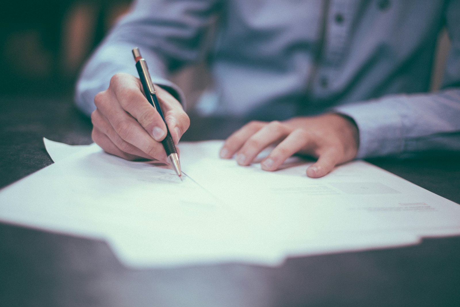 Memo and contracts on a desk